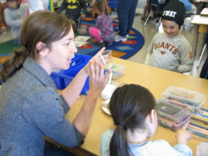 Leah Plack, teacher, with students during science lesson.